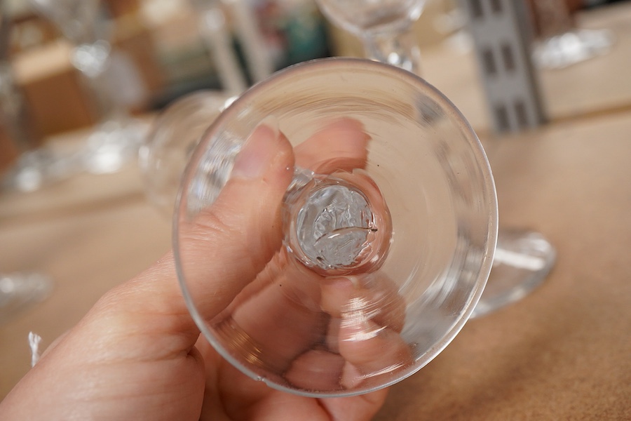 A pair of late 18th century wine glasses with faceted stems, 15cm high